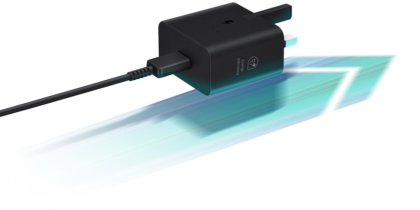 Samsung 25W Power Adapter without Cable Fast Charging for Smartphones, Tablets, Black 7 A black Power Adapter is seen casting a shadow on an arrow located below it that points to the right, to which the adapter's plug is also aligned.