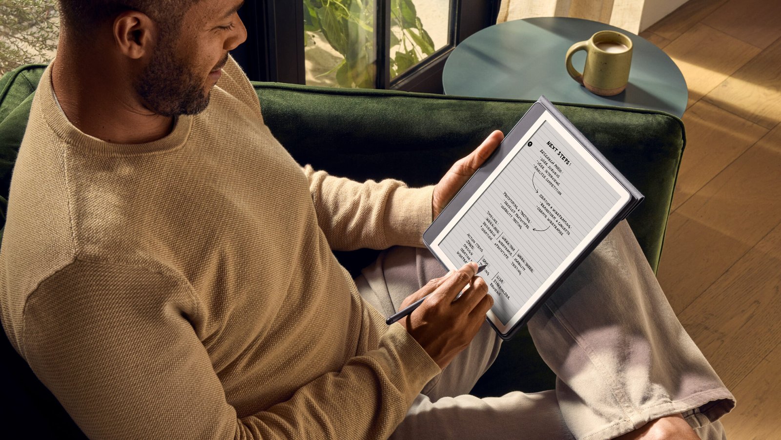 Amazon Kindle Scribe (64 GB) Kindle & Notebook in One, Includes Pen, 10.2” Display, Months of Battery Life, Metallic Jade 10 Person takes notes on Kindle Scribe with the Premium Pen.
